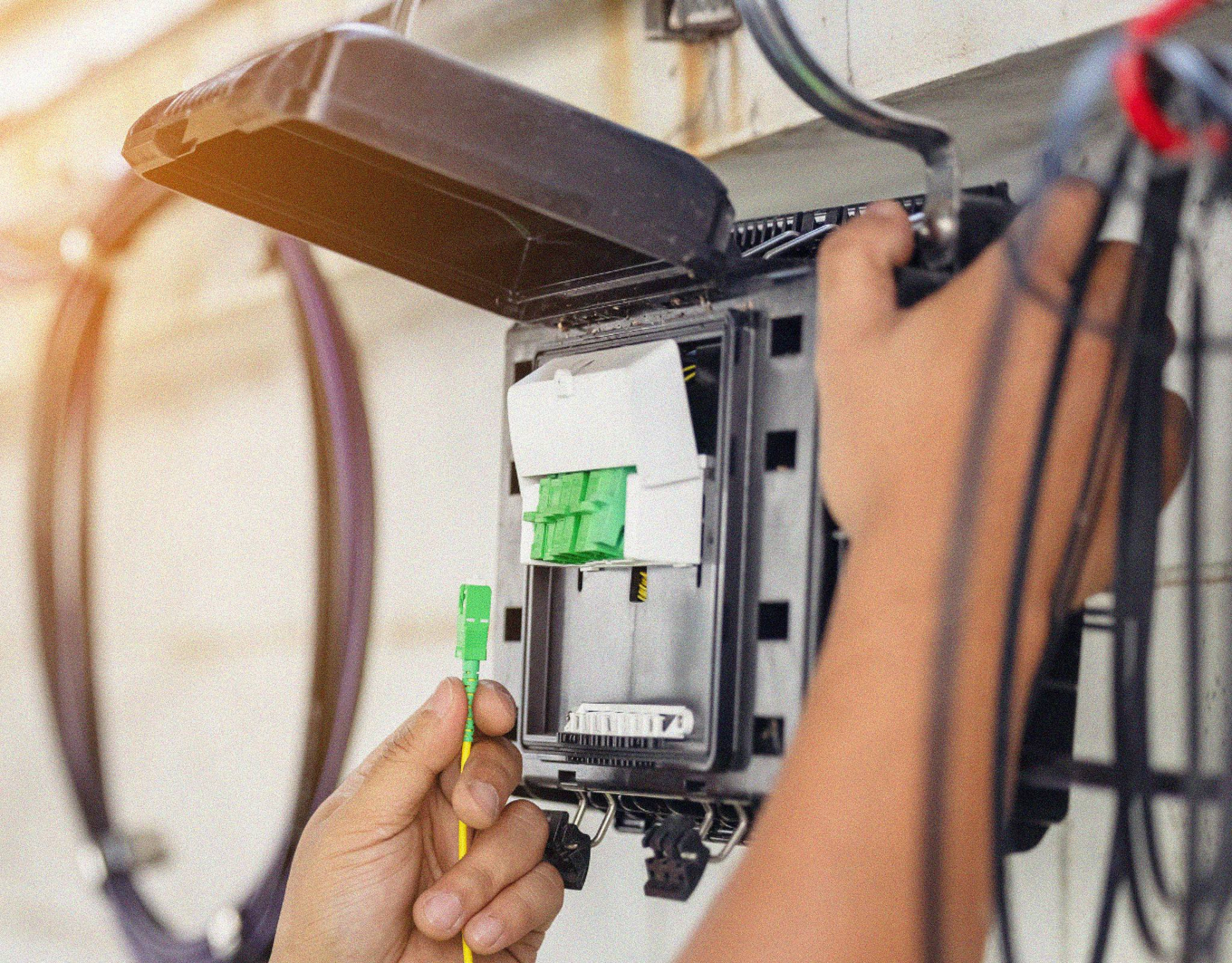 technician working on communications equipment