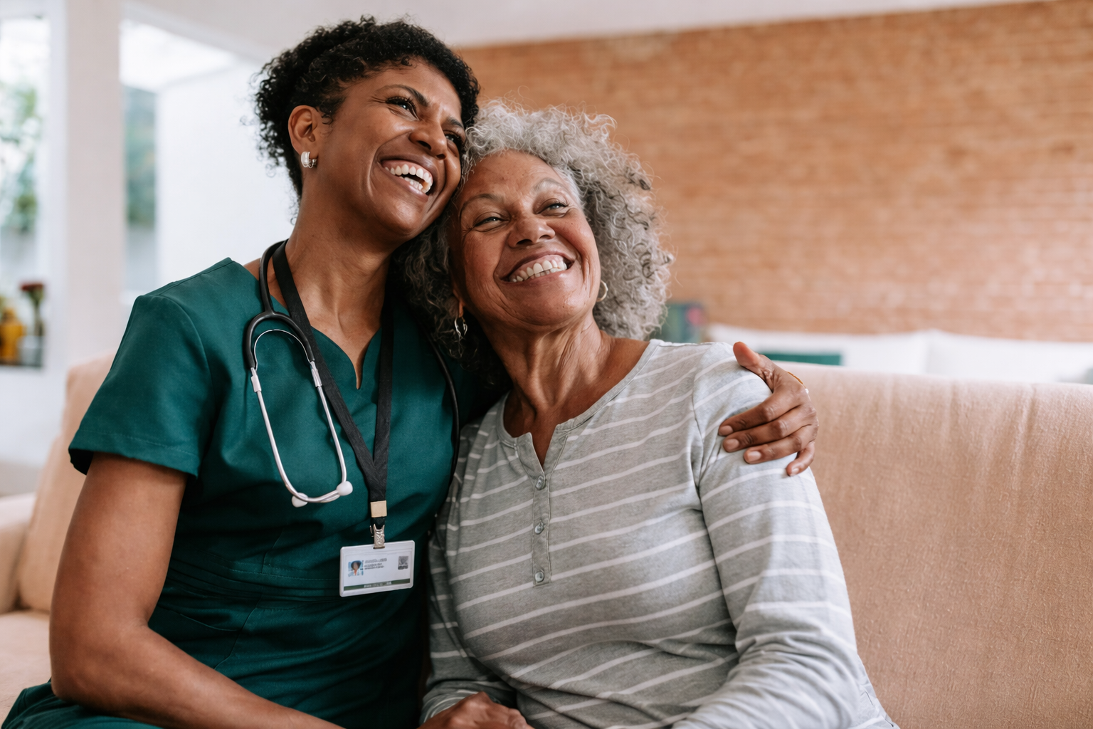 a black female healthcare professional hugging an elderly female patient