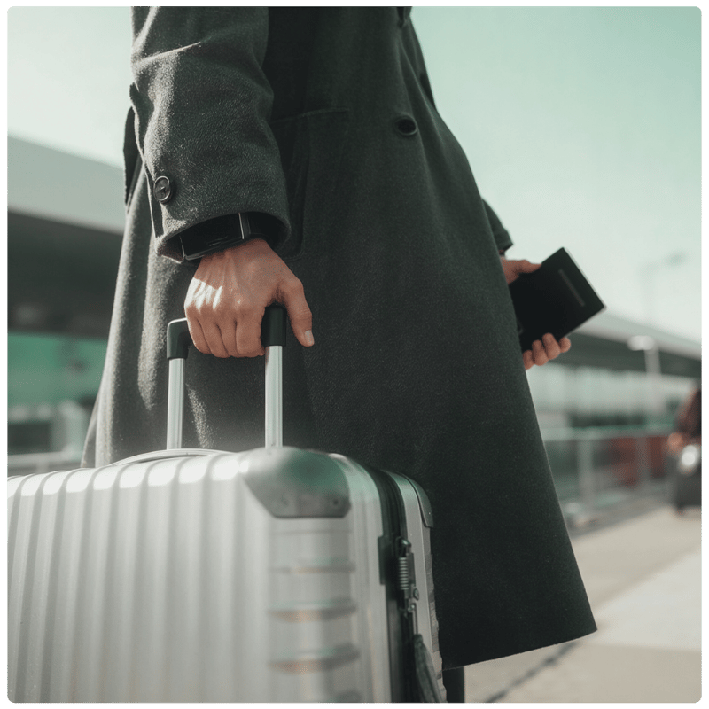 woman rolling a suitcase