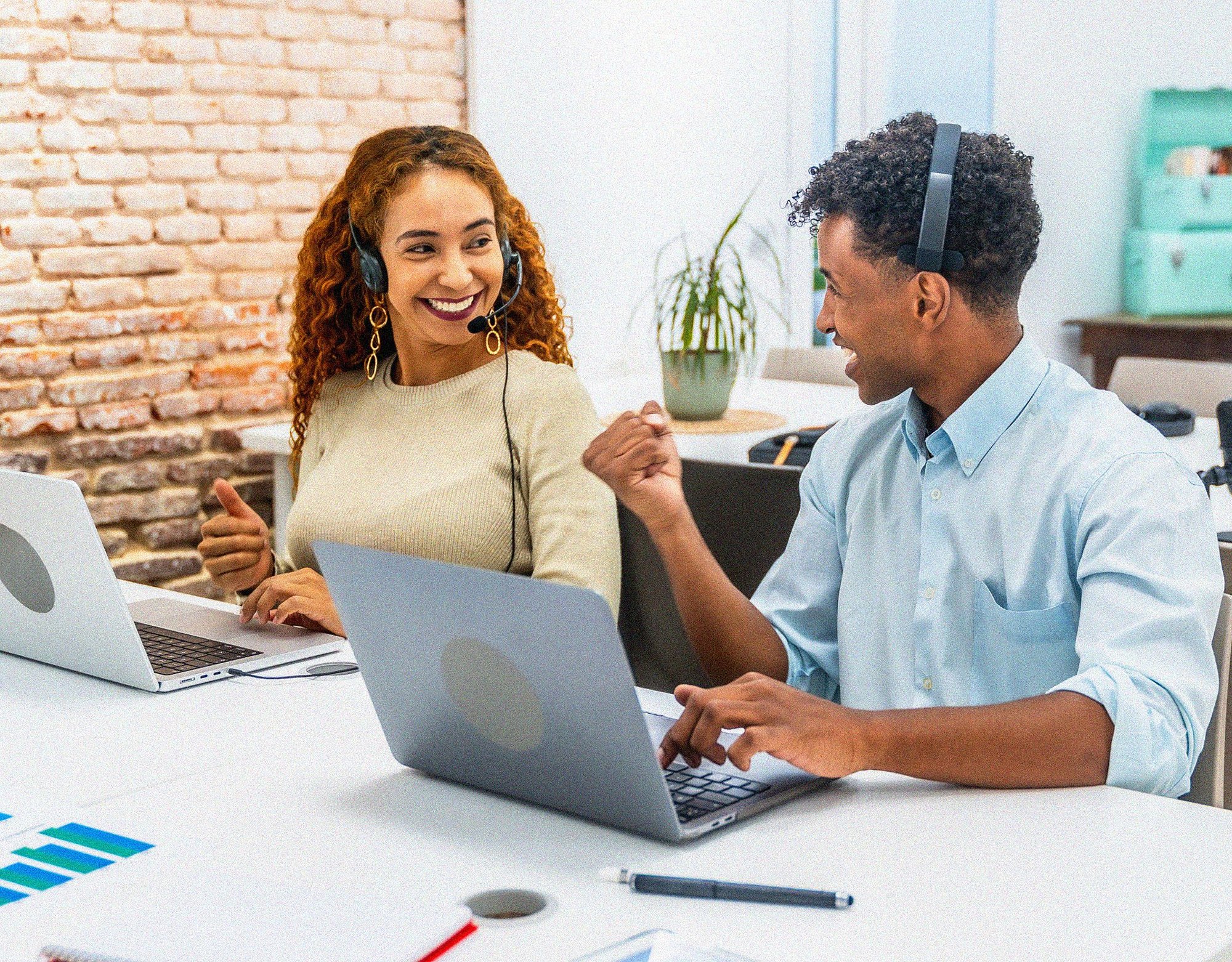 Technology professionals collaborating during a training session to adopt new platforms and ways of working.