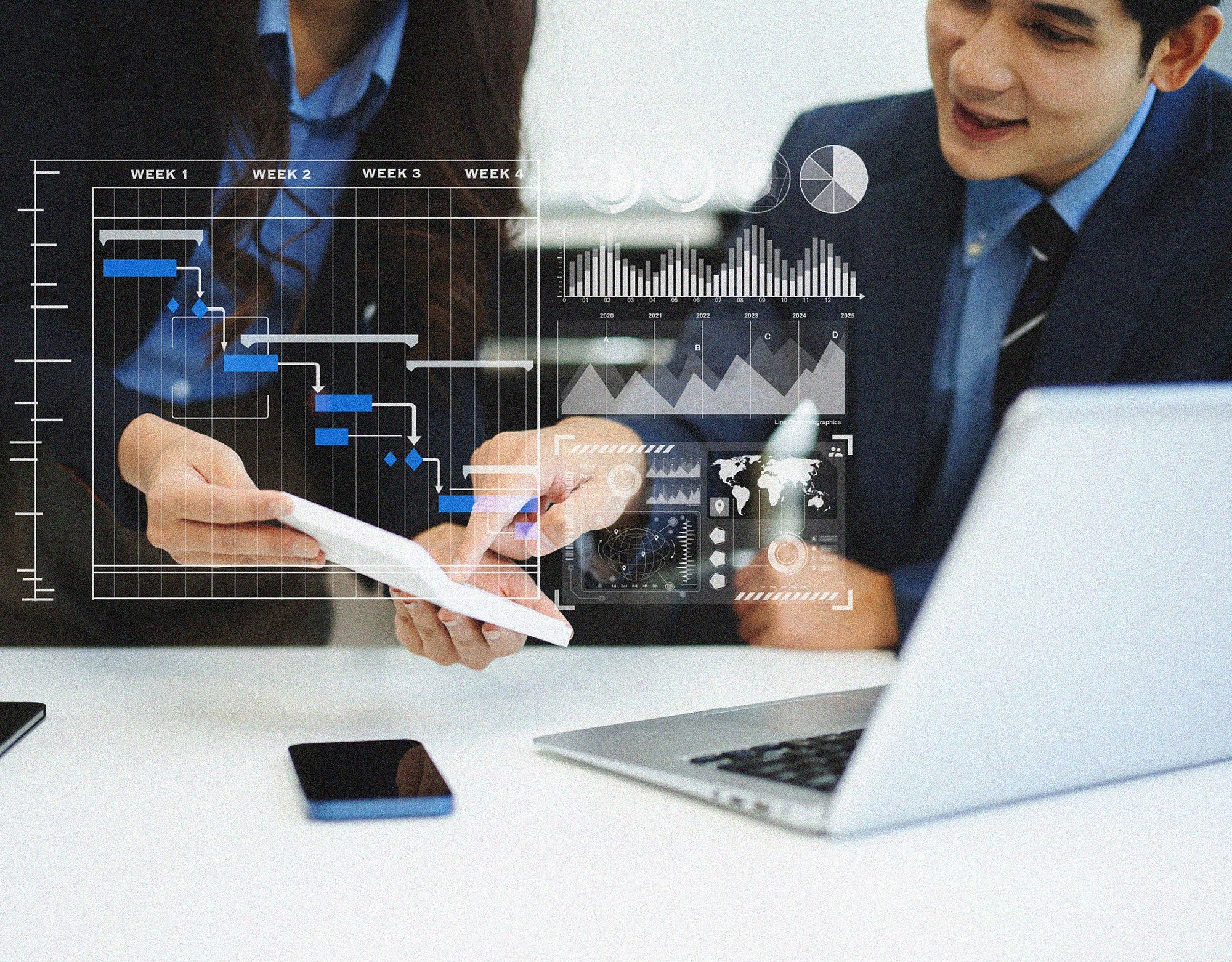 Team reviewing digital project dashboards and planning timelines to coordinate complex technology initiatives.