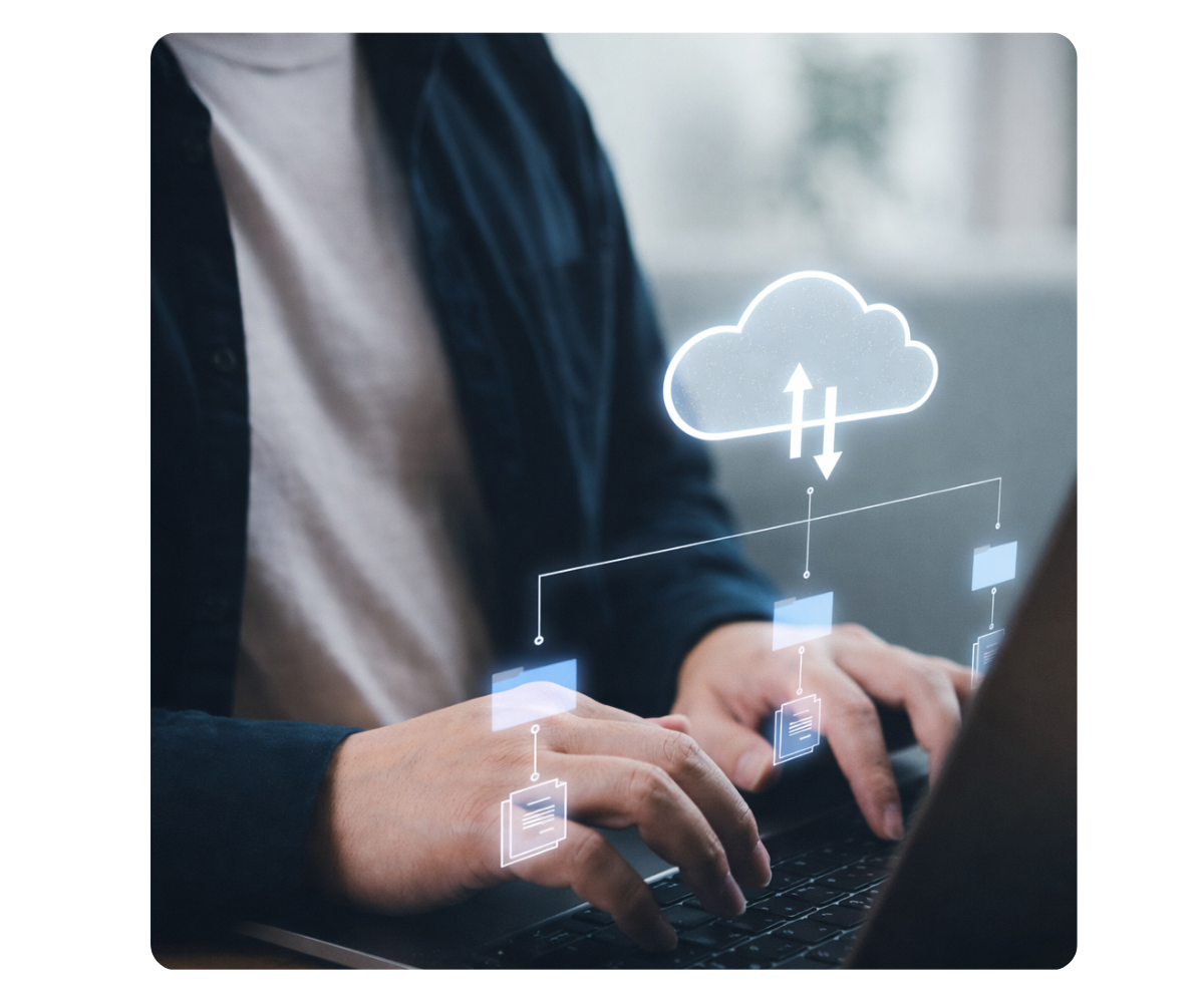 a female typing on a laptop with cloud icons illustrated over 
