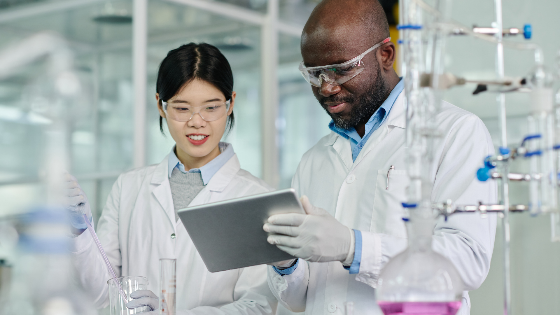 Featured image: Two scientists carrying out new trialWhy the next Blockbuster drug may be found in a data lake, not a laboratory
