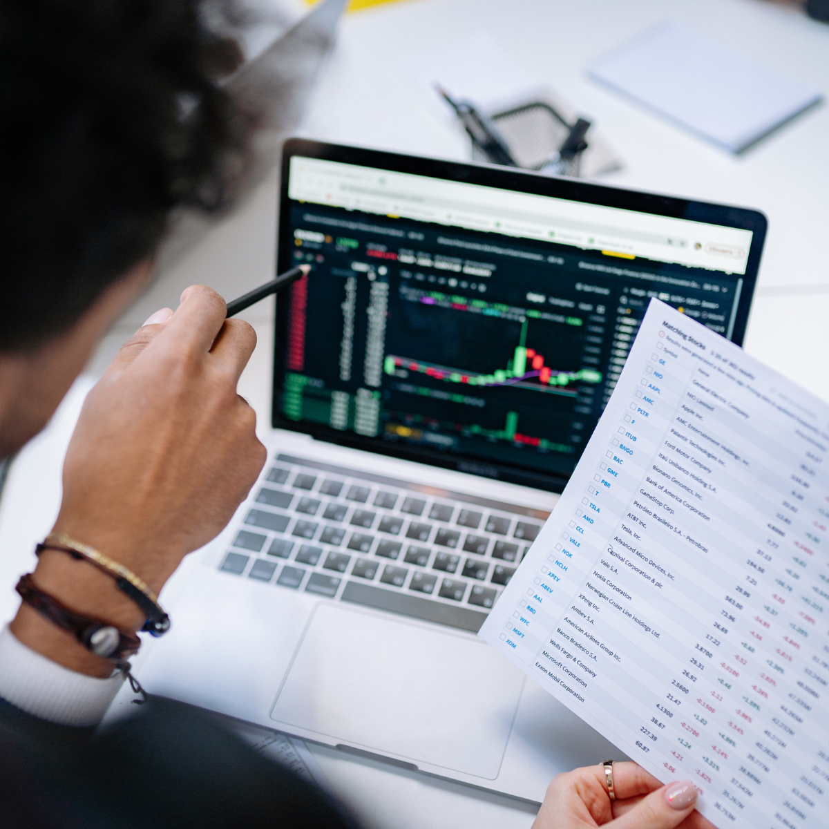 Featured image: financial graphs on laptopOperational resilience and cyber regulation in financial markets