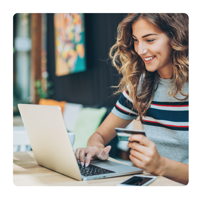 young white female conducting an online purchase with her credit card