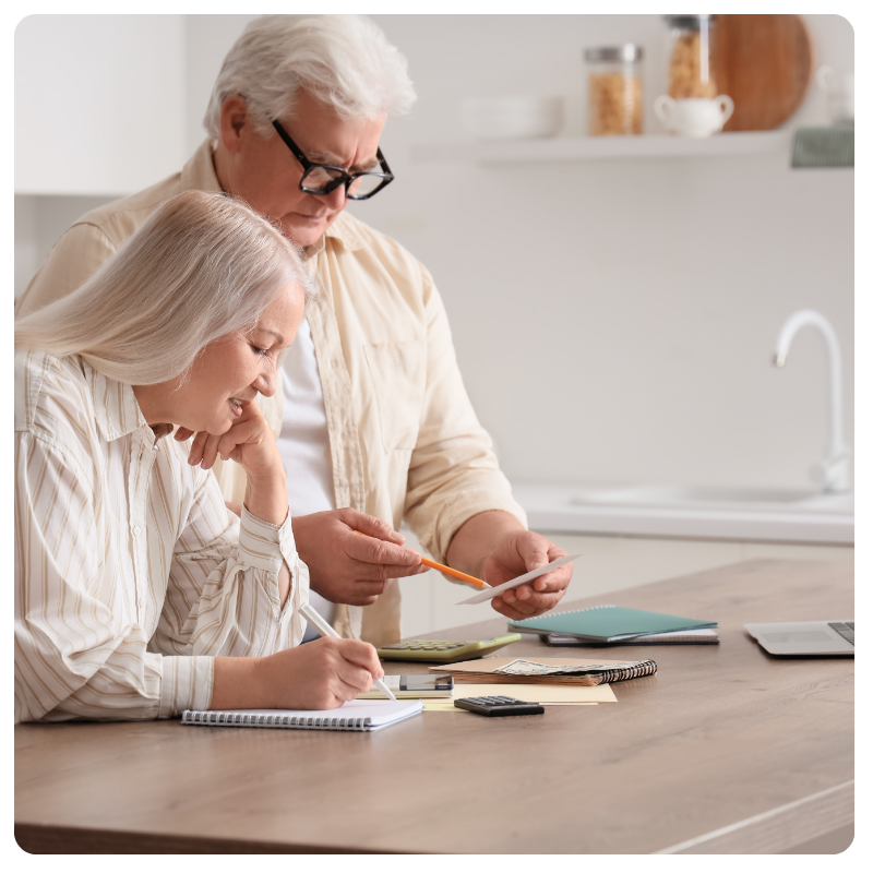 senior couple reviewing their bills