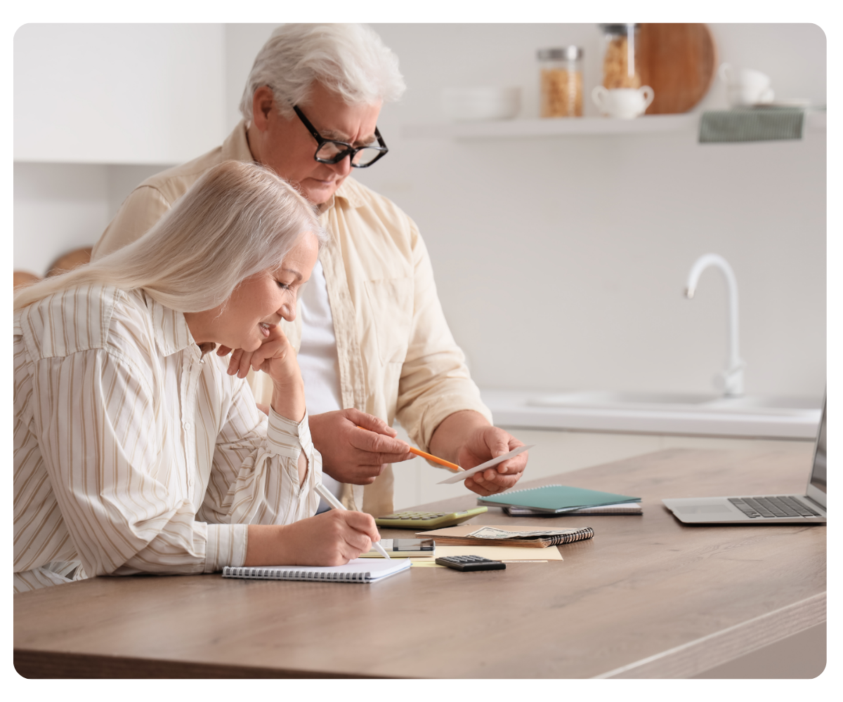 elderly couple calculating bills